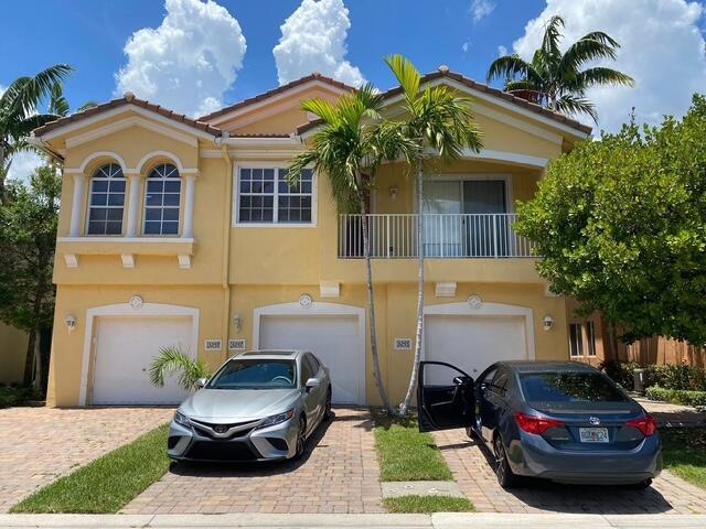 Just Listed ! Beautiful 2 bedroom 2 bath Townhome with attached one car garage. Open floor plan with split bedrooms . Both bedrooms accommodate a King Size bed. Spacious great room with dining area, covered Balcony of the Master Suite and access from the Great Room. High ceilings , new lighting,4 New ceiling fans 2024.New Honeybee blinds Great Room & Master Suite 2025, Plantation Shutters 2025  in the bathrooms and bedroom # 2 . Large kitchen with Granite counters, seating area for 4 bar stools (included), New Stainless Appliances 2024, New Sink 2024, New Garbage Disposal 2025, Freshly Painted and New Laminate Floors 2024, New carpet on the stairs 2024, AC Tuneup and cleaning 2025. AC 2018, Washer/Dryer 2021All age community that is Gated and has a Resort Style Pool and lake.