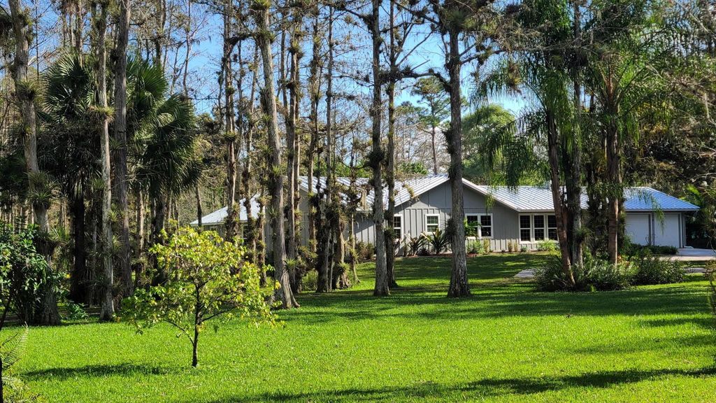 Photo of 13164 Compton Rd, Loxahatchee Groves, FL 33470 (MLS # F10418450)