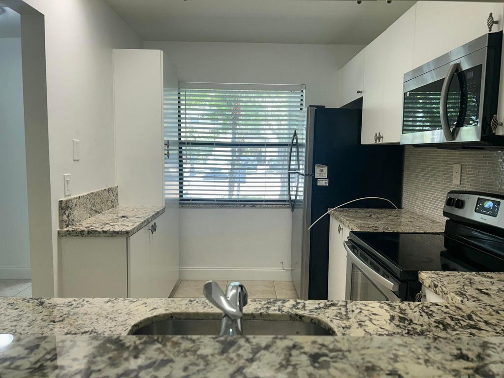Photo of 1290 S Military Trail #414, Deerfield Beach, FL 33442 (MLS # B26023773)