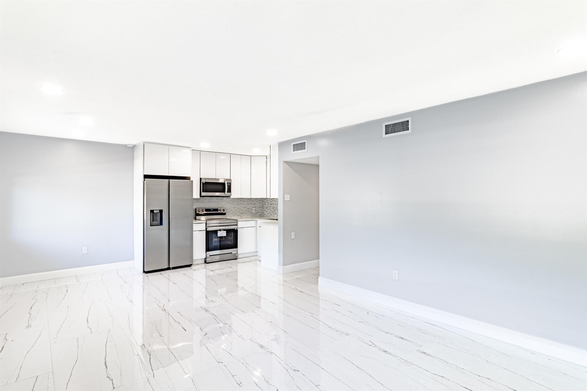 Remodeled and Move in Ready! This unit is Close to John Prince Park, JFK Hospital, Shopping, Palm Beach State College, as well as a short drive to Beaches. Remodeled Kitchen with brand new appliances, new bathroom, zebra blinds, and a community swimming pool make this turn key unit a great place to live. Ground-level unit offers porcelain tile floors, walk-in closets, an remodeled bathroom, and a stunning kitchen with upgraded cabinets and brand new stainless steel appliances. New A/C unit, as well as the modern zebra blinds on the windows and sliding doors. Each bedroom opens up to a spacious screened patio overlooking the canal. Schedule a showing today!