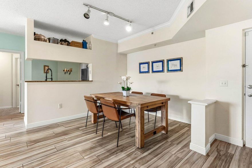 Enjoy resort-style living in a tropical gated Intracoastal community. This tastefully updated 2/2 features gorgeous wood-look tile floors (2017), brand new stainless steel oven/cooktop and dishwasher (2025), fridge (2021), water heater (2018), AC fan motor (2025), and more.  Both spacious bedrooms have en suite bathrooms.  The laundry room has a full-size washer and dryer. And the comfy back patio draws in warm salty breezes year-round. Tuscany amenities include indoor basketball, billiards, tennis, pickleball, fitness center, waterfront pool, spa, BBQ  and picnic area, a boardwalk along the intracoastal and much more. Waterfront dining, shops and groceries are literally around the corner, as are world-class beaches and the famed nightlife of Delray Beach and Atlantic Ave. See photos... The new roof was installed just installed in 2024.

Sunshine Square Shopping Plaza is just around the corner and has Publix, Panera, Crown Wine & Spirits, MD Now Urgent Care, dining, fitness, spa, hair & nails, banking, pet needs, and more.  Across from Sunshine Square is Starbucks, Chipotle, Walgreens, and more...

Bethesda Hospital - A comprehensive, full-service hospital - is less than 1 mile away.

Also nearby is Boynton's "Town Square" redevelopment project which is transforming the downtown and affecting property values all around it.

Please see the attached photos and aerials, which are sequenced with descriptions as a 'virtual tour' of the property and surrounding area.  And come grab a slice of paradise.

*Seller has paid all special assessments.  The current monthly maintenance fee includes an additional amount to fund the reserves.

*Disclaimer: All seller/agent representations, measurements, distances, property descriptions, etc. are believed accurate but must be verified by buyer/buyer's agent. It is incumbent upon buyer/buyer's agent to verify all property information, inquiries and/or representations