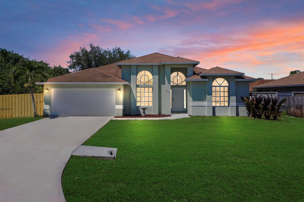 Photo of 565 SW Halkell Avenue, Port Saint Lucie, FL 34953 (MLS # R11068682)