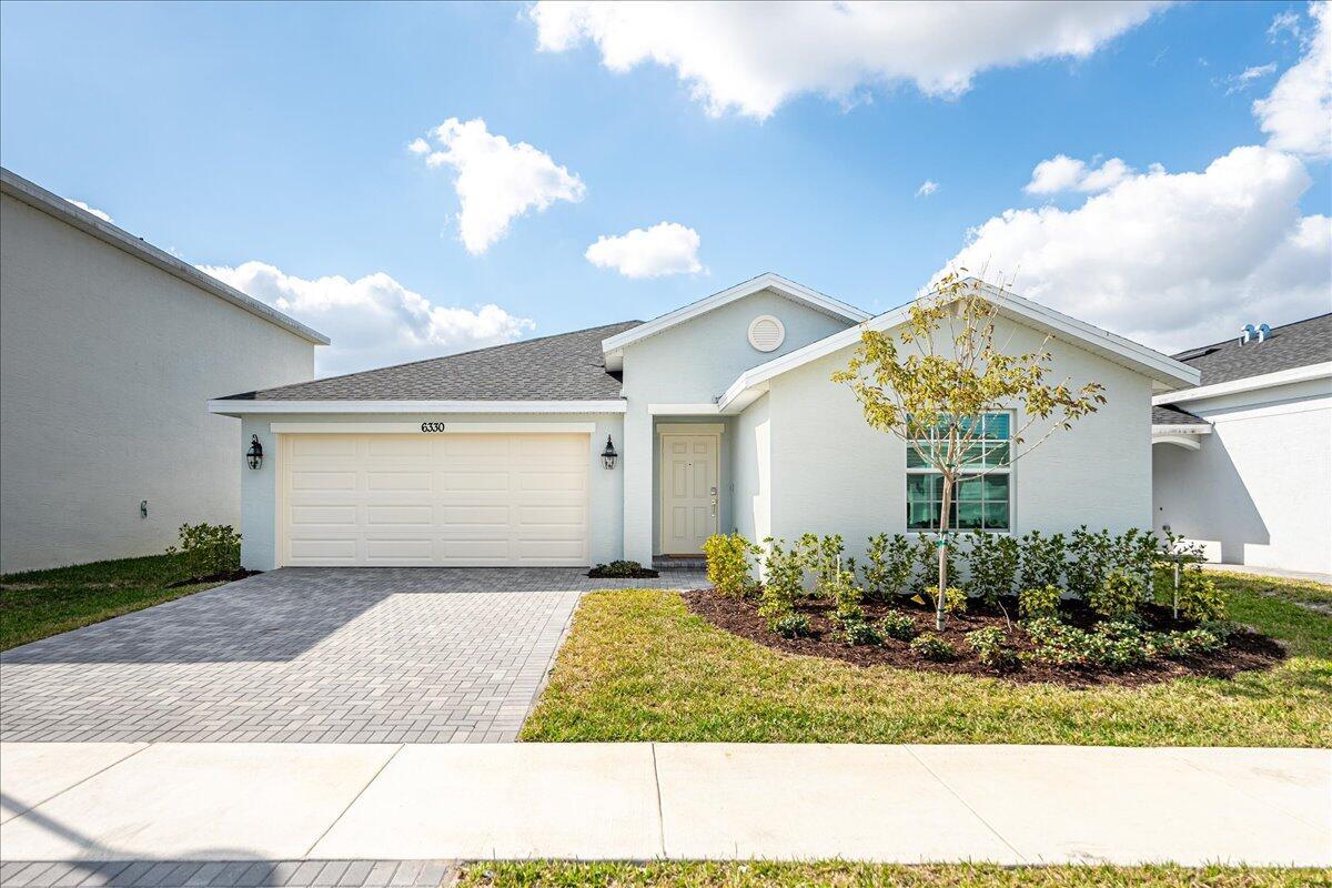 Special promotion for the month of July offered 5.99% rate for preferred lender. This Brand New, Never Occupied Home!*** This stunning 4-bedroom, 2-bath home offers an open-concept layout, seamlessly connecting the kitchen, dining, and living areas. The owner's suite is ideally located in the back corner of the home with an en-suite bathroom. One of a kind corner lot with a ready-to-use patio overlooking the lake. The home includes a convenient two-bay garage, stainless steel appliances, a gas range, quartz countertops, upgraded light fixtures and a Ring doorbell system. *Located in a gated community with a beautiful clubhouse, fitness center, community pool, pickleball courts, playground, and more! Hurry and grab this perfect corner lot and make this house your beloved family home