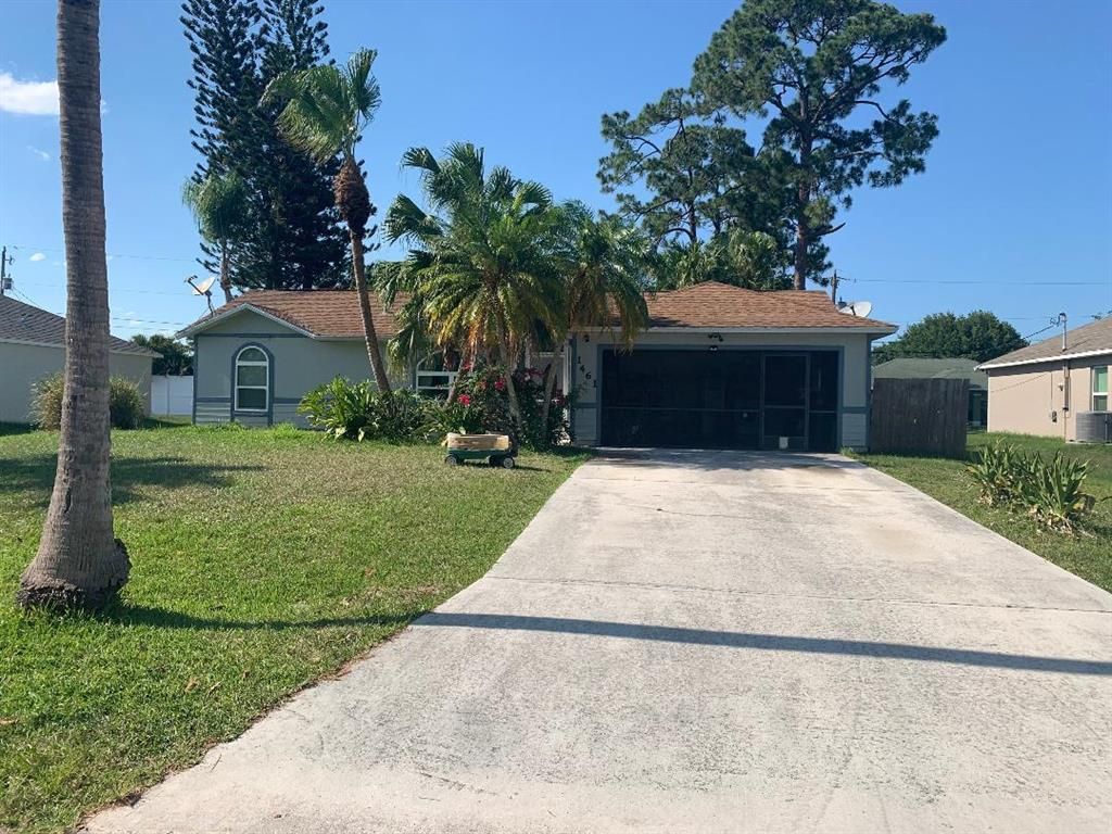 Photo of 1461 SW Medina Avenue, Port Saint Lucie, FL 34953 (MLS # R10716318)