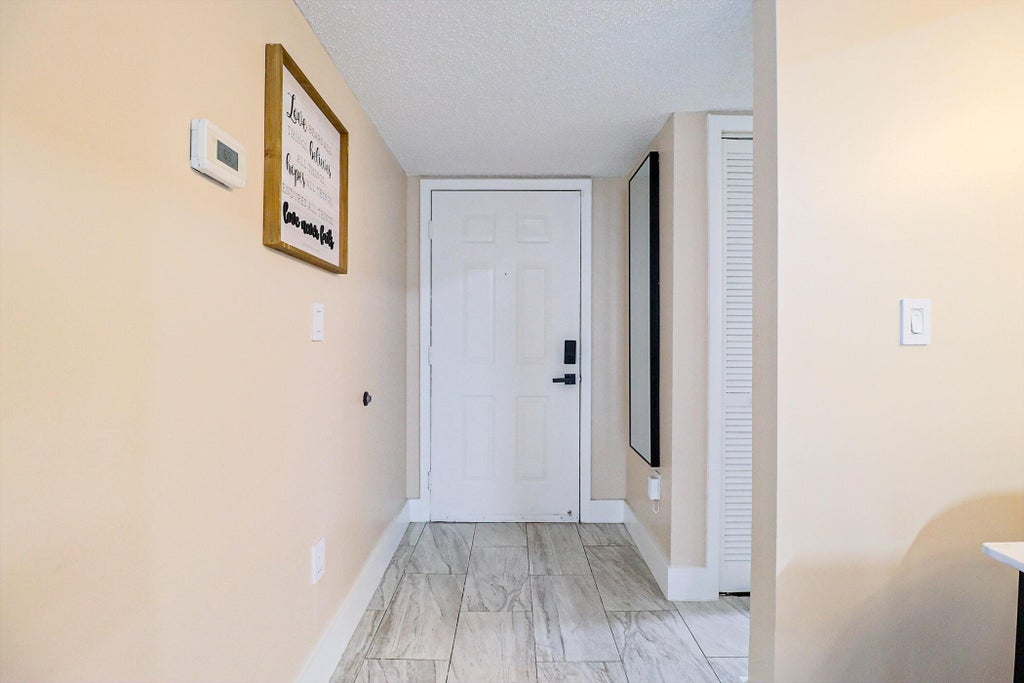 Photo of 450 PALM Circle W #106, Pembroke Pines, FL 33025 (MLS # B26066741)