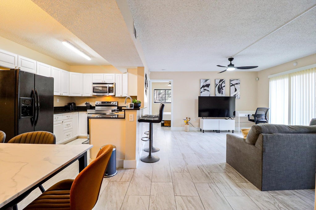 Photo of 450 PALM Circle W #106, Pembroke Pines, FL 33025 (MLS # B26066741)
