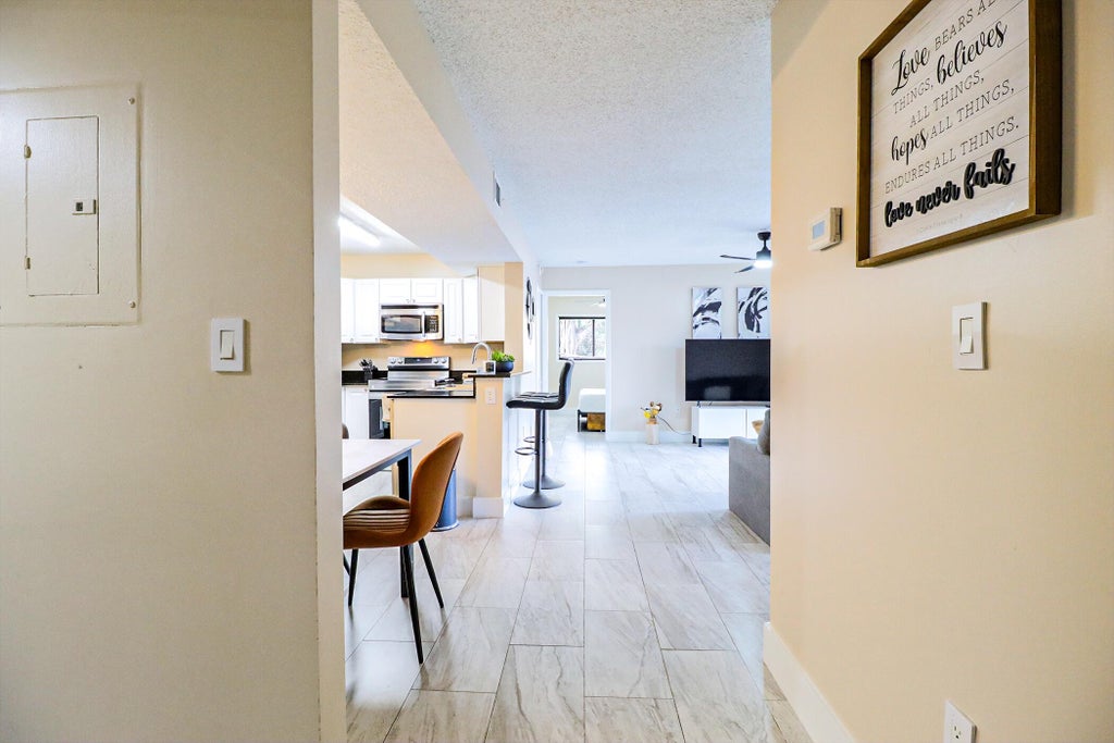Photo of 450 PALM Circle W #106, Pembroke Pines, FL 33025 (MLS # B26066741)