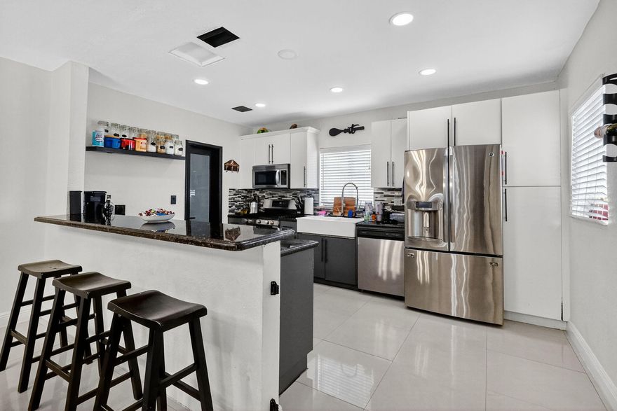 Stunning 5BR/3BA home on a prime corner lot with an inviting open floor plan and plenty of space for family and guests. Enjoy a bright, airy main living area that flows seamlessly into the kitchen and dining spaces. A flexible bedroom layout includes a private in-law-quarters option - perfect for extended family, guests or a comfortable multi-generational living setup. From 2021/22 the home was equipped with hurricane impact windows all throughout and A/C. Also, the roof was recently installed in 2020! Step outside to your own private backyard oasis complete with a sparkling pool-ideal for relaxing or entertaining. This is a rare companion of size, comfort and outdoor living.