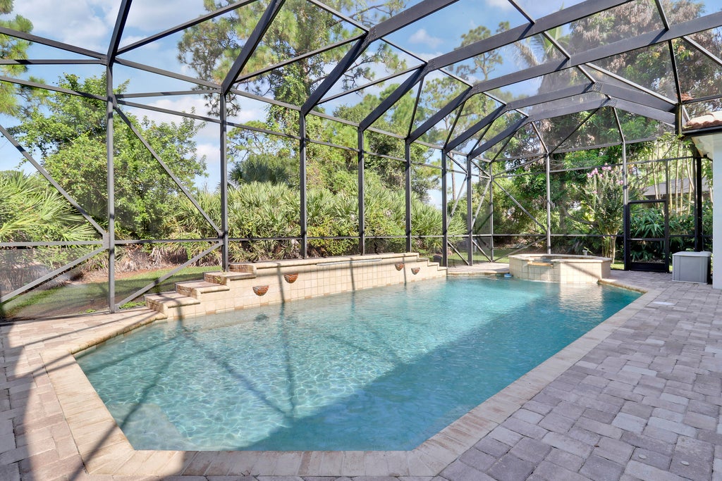 Photo of 8605 Tompson Point Road, Port Saint Lucie, FL 34986 (MLS # B26068195)