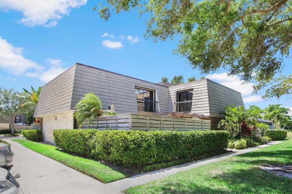 This BEAUTIFUL remodeled PGA townhome is waiting for you and move in ready! Its a ''Smart'' home with accordion shutters and generator. It comes Fully furnished with a gorgeous view of the lake in the acclaimed Golf Course community of PGA National. You will find plenty of peace and quiet here!