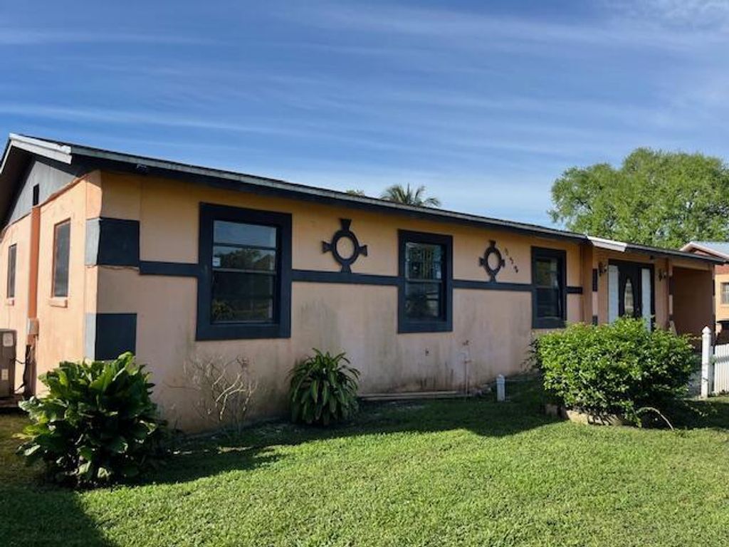 Photo of 932 SW Avenue H, Belle Glade, FL 33430 (MLS # R11073134)