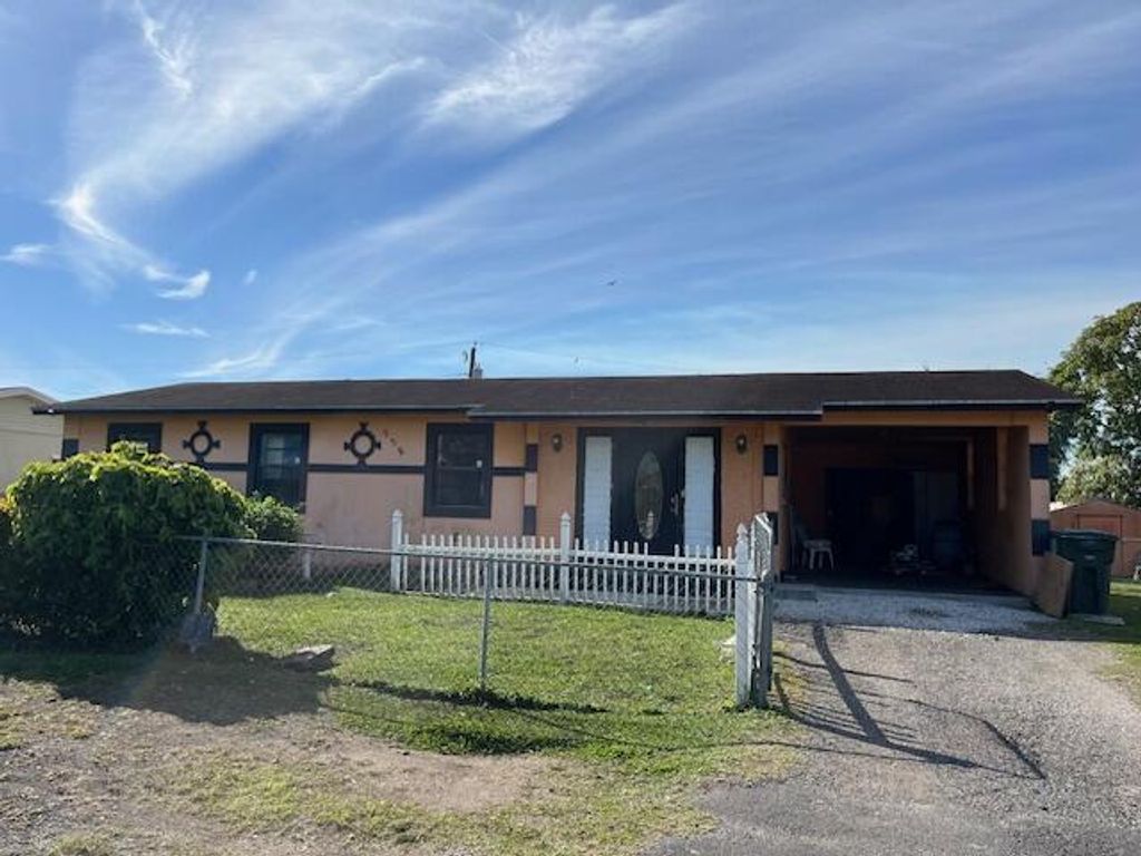 Photo of 932 SW Avenue H, Belle Glade, FL 33430 (MLS # R11073134)