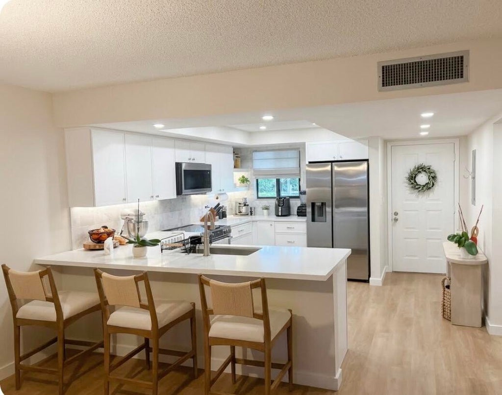 Photo of 3154 VIA POINCIANA #114, Lake Worth, FL 33467 (MLS # B26091448)