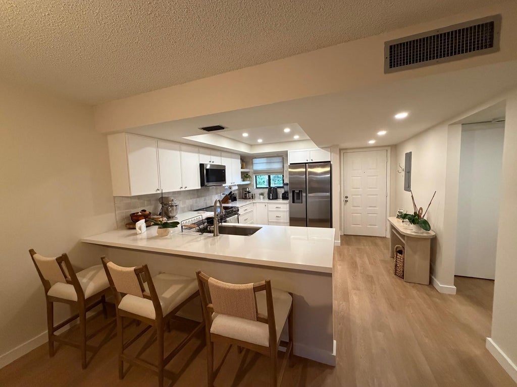 Photo of 3154 VIA POINCIANA #114, Lake Worth, FL 33467 (MLS # B26091448)