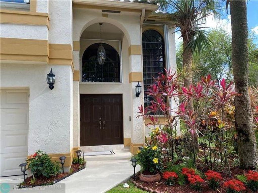 Photo of 5721 NW 63rd Pl #5721, Parkland, FL 33067 (MLS # F10380798)