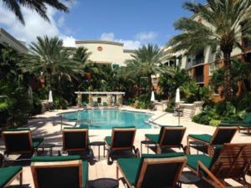 Immaculate 1bedroom plus den/guest room with large private fenced in courtyard.a condo that lives more like a townhouse! Exquisitely furnished this unit offers hardwood flooring throughout, granite countertops, spacious closets and is being rented turnkey. At the Prado you can enjoy 24 hour security, heated swimming pool, lush landscaping, fitness center and club room. The Prado is conveniently located in the middle of downtown West Palm Beach, steps to CityPlace, Clematis and Palm Beach Island.