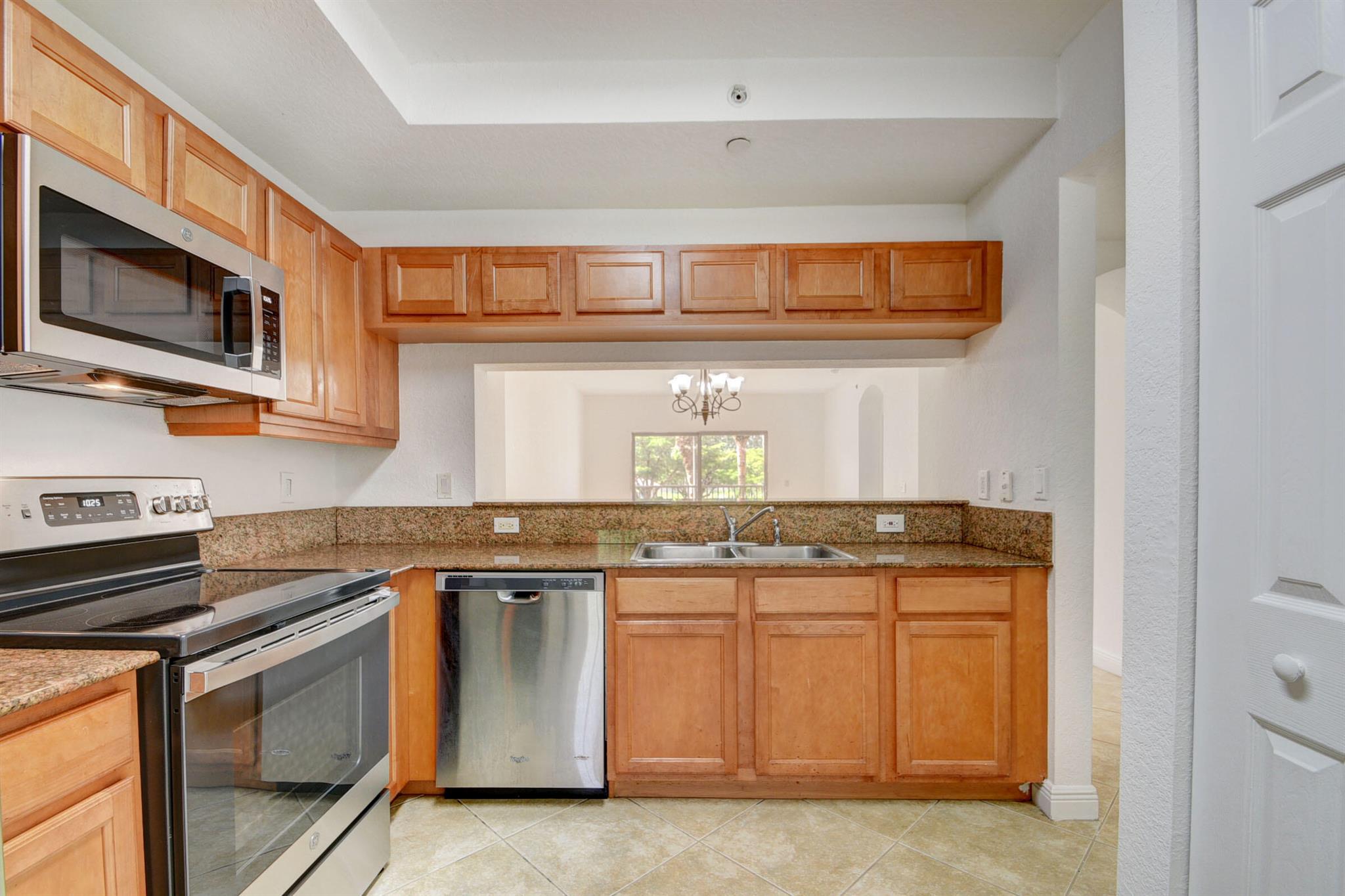 NEW ROOF! IMPACT WINDOWS & DOORS. Instantly feel at home in this large sunny & bright 2/2 + den home in Lucerne Lakes. Located in the newest elevator building (built 2005) in the community, your upgrades include ceramic tile set on the diagonal, SS appliances (new stove & microwave) wood cabinets, granite counters & new hot water heater. It also features a freshly painted interior, knock down ceiling, interior laundry room w/full size washer and dryer & tons of storage. The unit boasts almost 1400 sq ft. of living space plus a wonderful screened patio to enjoy your Florida sunshine. Steps to the pool exclusive to the Fairway Club. Lucerne Lakes has an active clubhouse w/tennis, full gym & a resort style pool. Wonderful location near great shopping & restaurants. Move in ready. Call today!