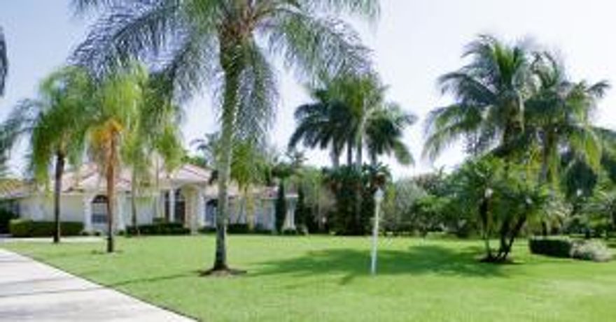 Beautiful, updated home with lush landscaping, water front view on 1.33 acre lot.  4 bedrooms, 3 baths plus office.  Large master bedroom and bath.  Wonderful large 1800 square feet screen enclosed entertaining area along with pool. Beautiful expansive private rear yard leading to the water. School listed as per Current School Board site.