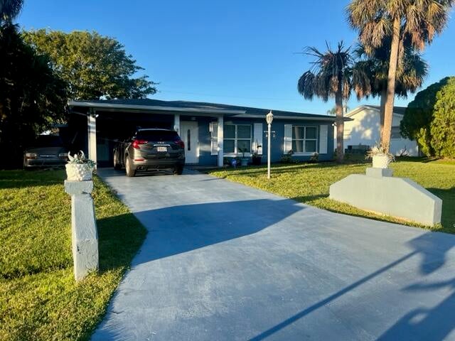 Photo of 525 NW Billiar Avenue NW, Port Saint Lucie, FL 34983 (MLS # R10930651)