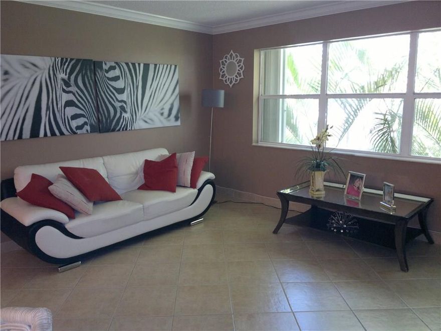 VERY NICE CORNER UNIT, UPDATED, WITH WASHER AND DRYER, AC 3 YEARS, WATER HEATER 2 YEARS, LARGE MASTER BEDROOM WITH FULL WALL OF CLOSET, SECOND BEDROOM WITH WALK IN CLOSET, AND ATTIC ACCESS FOR EXTRA STORAGE. NEUTRAL, BEAUTIFUL TILES THROUGHOUT FOR A GREAT UNIFORM CLEAN LOOK. KITCHEN WITH NEW STOVE AND LARGE BAR AREA OPEN TO DINING. HURRICANE SHUTTERS ON ALL WINDOWS. CLOSE TO THE BEACH AND SHOPPING. ALL AGES. CAN BE RENTED RIGHT AWAY. LOW MAINTENANCE FEE.  EASY TO SHOW. DESIRABLE DEERFIELD BEACH AREA.