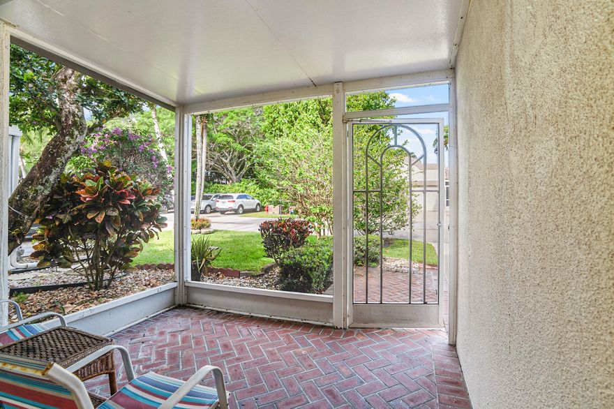 Charming 2 Bedroom,2 Bathroom Villa with 1-car garage. Garden view. Plus a LOW HOA. Enjoy beautiful serene pool and lake. Screened in front porch perfect for relaxing. This home features an Updated Open layout kitchen with granite countertops, stainless steel appliances, and tile flooring throughout. Both bathrooms have been tastefully updated. The home includes a New Ac 2023, New WH 2023, New GE electrical panel for peace of mind. In unit Washer/Dryer for convenience. Ideally located just a Short walk to active clubhouse offering a heated pool, tennis and bocce courts, game and exercise rooms. Close to shopping, restaurants and entertainment. This home is a must see opportunity!!