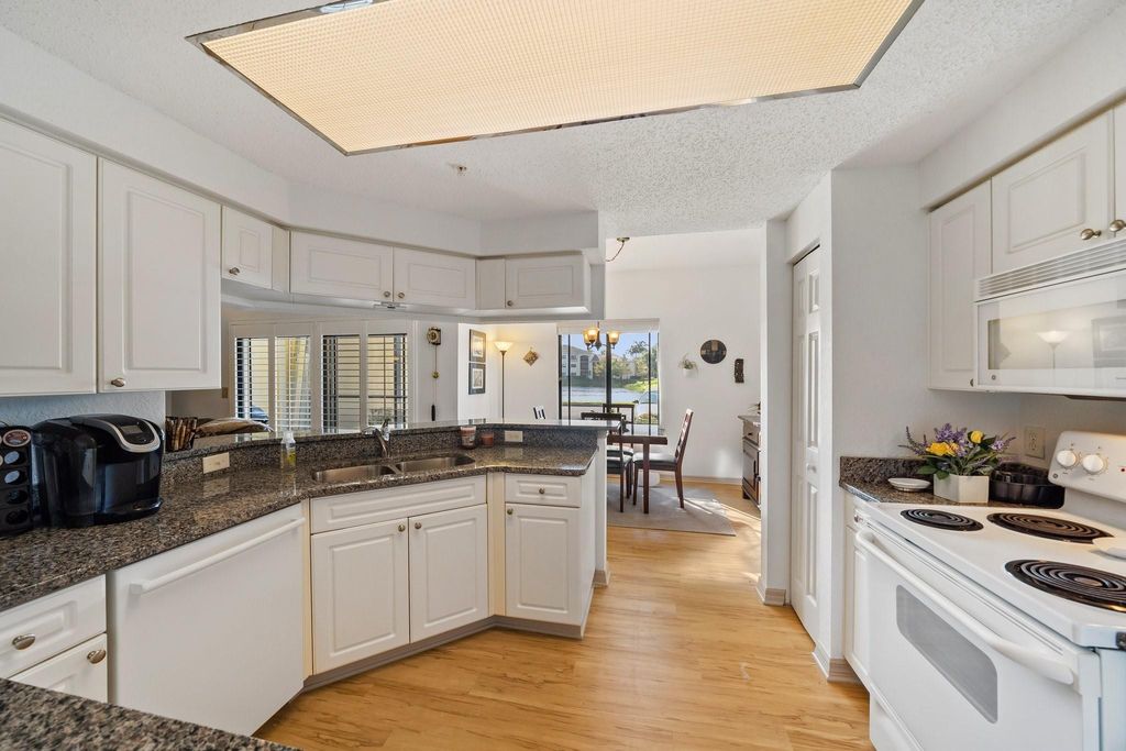 Photo of 3019 Alcazar Place #107, Palm Beach Gardens, FL 33410 (MLS # F10539346)