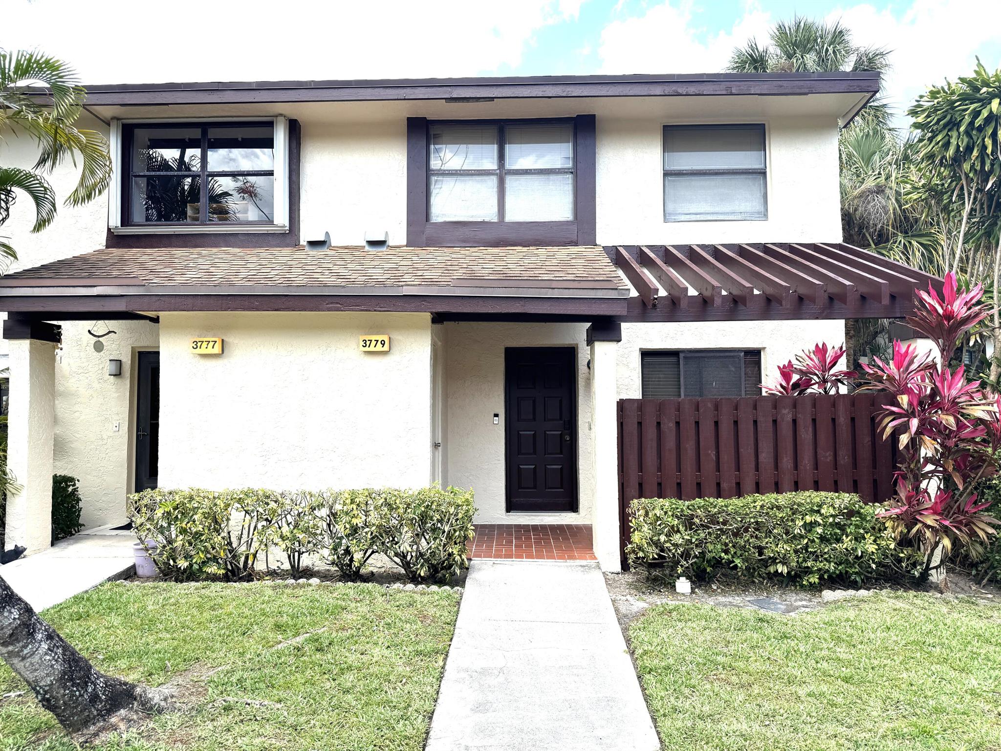 FEATURED HOME in the Township PARADE OF HOMES SAT, JUNE 28TH 11-3Welcome home to a delightful townhome in Tartan Coconut Creek AKA Golden Raintree VI of the wonderful Township development. Walk in to lovely large porclein tile flooring in the foyer, kitchen and bath. This 3 bedroom 21/2 bath townhome has a beautifully updated kitchen, with granite counters, decorator cabinets and stainless appliances. The half bath downstairs and the 2 full baths upstairs have been redone with beautiful cabinetry and decorator lighting. This home features a screened in patio that overlooks a serene large lake and greenery. Upstairs are 3 large bedrooms, a full bath and the owners bath off the large bedroom.The outside of the home has been recentlly painted by the association.