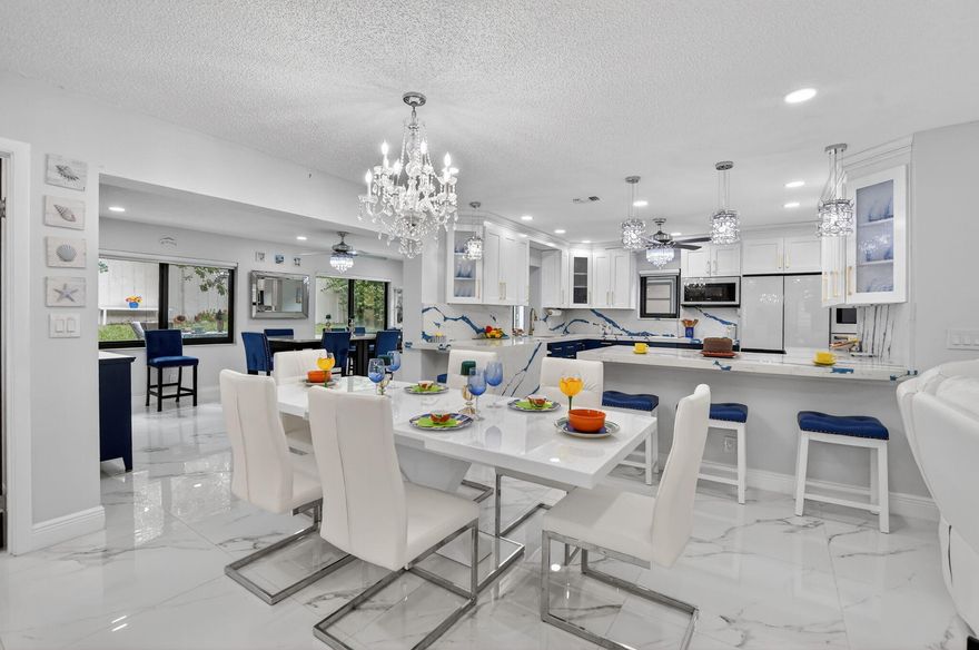 ONE OF A KIND! Exquisitely remodeled 3BR/2BA home offering 1,700+ SF in sought-after Meadows of Crystal Lake (55+). This light-filled residence features an open-concept layout w/ GORGEOUS 32x32 porcelain tile throughout, LED lighting + ALL IMPACT WINDOW & DOORS. The 2025 NEW designer kitchen showcases quartz countertops, custom cabinetry, & high end Samsung Bespoke appliances. HUGE primary suite w/ custom closet & beautifully updated bath. Two additional bedrooms offer flexibility for guests or office space. Entertaining is a breeze in your XL family room w/ landscaped surroundings. Additional highlights include a 2023 roof & A/C, INSIDE LAUNDRY ROOM, tankless WH, updated electrical, & 1-CG. Community amenities include clubhouse, pool, fitness, tennis, pickleball, and more. Low HOA!  Friendly community with activities, trips, excursions and shows. Come see this beauty that is a rare find in turn key condition!