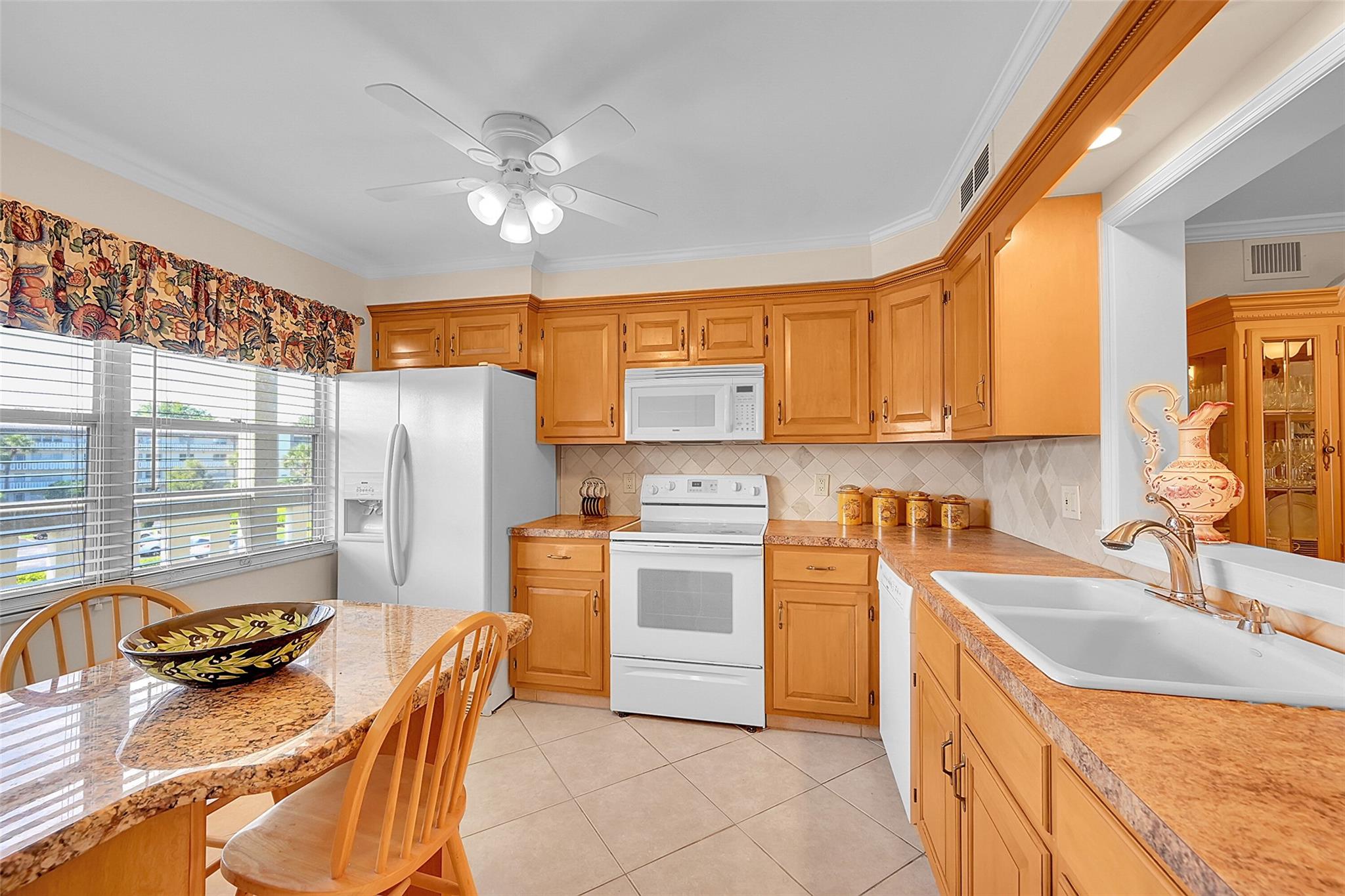 PRICED FOR A QUICK SALE!. BEAUTIFUL FULLY FURNISHED 2 BEDROOM/2BATH CONDO AVAILABLE IN ONE OF THE TOP VILLAGES IN WYNMOOR. WALK IN DISTANCE TO THE CLUBHOUSE AND TENNIS/PICKLEBALL COURTS. NEWER KITCHEN CABINETS WITH GRANITE COUNTER TOPS. CEREMIC THROUGH-OUT. HARDWOOD IN LIVING AREA. NO POPCORN. CROWN MOLDING ALL AROUND. FANS IN EVERY ROOM. WATER HEATER (2019). UPDATED BATHROOMS. A MUST SEE!. ASSOC REQUIRES 20% DOWN & 1 OCCUP 55+
