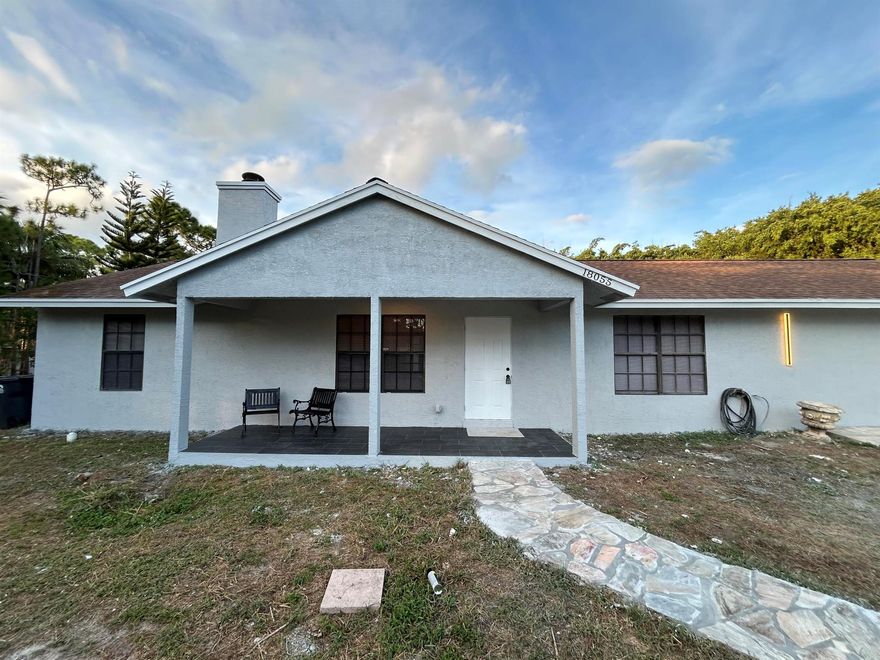 Welcome home to this beautifully restored home. This home has a split floor plan with tile flooring throughout. Roof was installed in 2021! Upon entering the home you will be greeted by a large open living dining area for entertaining. The living area has a decorator inspired wall with shiplap and inserted fireplace! Centrally located home on 1 acre of land, this home is fully fenced with large open spaces for your toys, kids and pets! The kitchen has brand new white shaker cabinets, granite counter tops and new appliances. Beyond the kitchen tucked away is a large family room with access to the roofed in patio. Updated bathrooms with nice vanities! This home has a NEW AC and has been freshly painted in and out. patio has separate laundry area with tons of storage space. New blinds, too