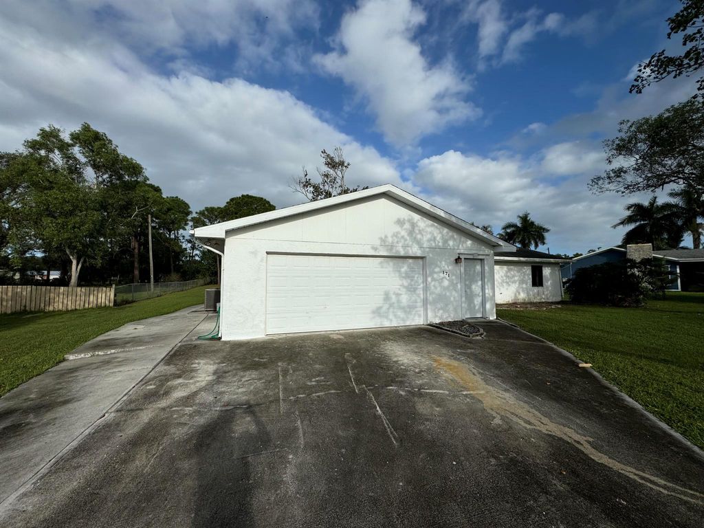 Photo of 171 NE Twylite Terrace, Port Saint Lucie, FL 34983 (MLS # R11034829)