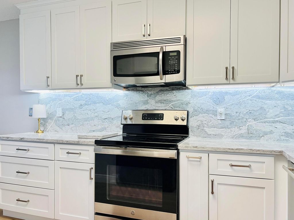 Photo of 4725 E Lucerne Lakes Blvd Boulevard E #311, Lake Worth, FL 33467 (MLS # B26011202)