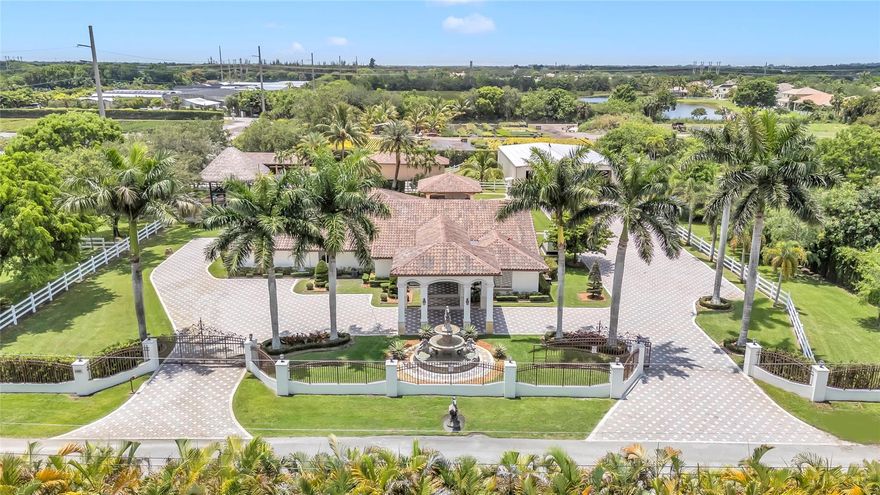 Welcome to this ultra-luxury estate in prestigious Southwest Ranches, set on 2.03 meticulously maintained acres. Fully renovated with no expense spared, this exceptional property is a true masterpiece. The estate includes 8 horse stables & a separate 4,000 sqft garage featuring a private upstairs office with A/C, ideal for conversion into a guest house and another 1,000 sqft garage/storage area. The main residence spans 4,000 sq ft under air and showcases 5 bedrooms, 4 bathrooms, impact windows, a redesigned private gated driveway, and a laundry/utility/mudroom for added functionality. Step outside to your private resort-style oasis, complete with a large pool, Brazilian teak wood ceilings, a summer kitchen, a pool house, and a stunning two-story tiki hut with electric and lighting.