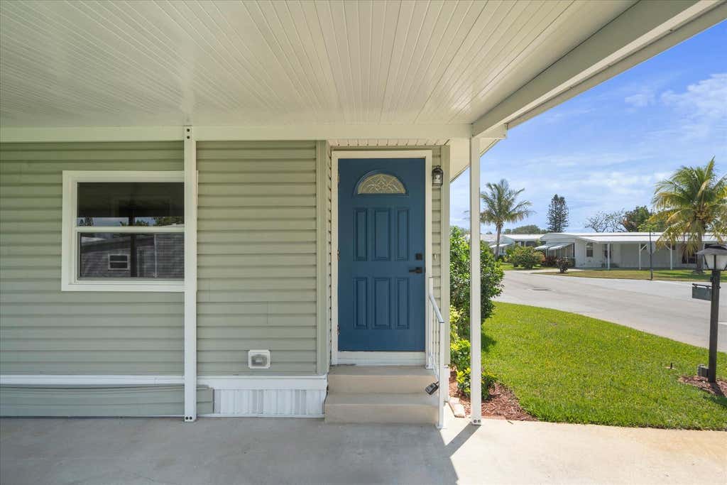 Photo of 309 NE Pinelake Village Boulevard, Jensen Beach, FL 34957 (MLS # R10955251)