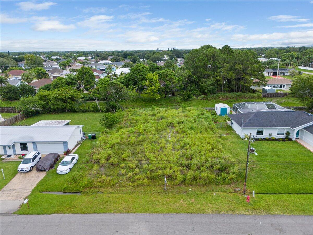 Build your dream home on this already cleared lot. Located close to the Turnpike, Saint Lucie West and Tradition.