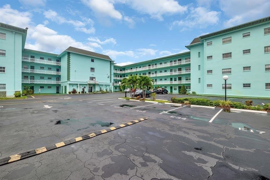1/1.5 home with modern kitchen and bathrooms tasteful decor, first-floor lake view apartment located in a wonderful community with numerous amenities. Master bedroom with ensuite bathroom featuring dual sinks and a deep walk-in closet. Enclosed patio used as den or office. In addition to the enclosed patio, unit features a private rear open balcony overlooking the lake, making it ideal for entertaining. Enjoy the community pool, tennis court, fitness center, library, and card room. Development conveniently located near shopping, dining, and major highways. Make this your home today.
