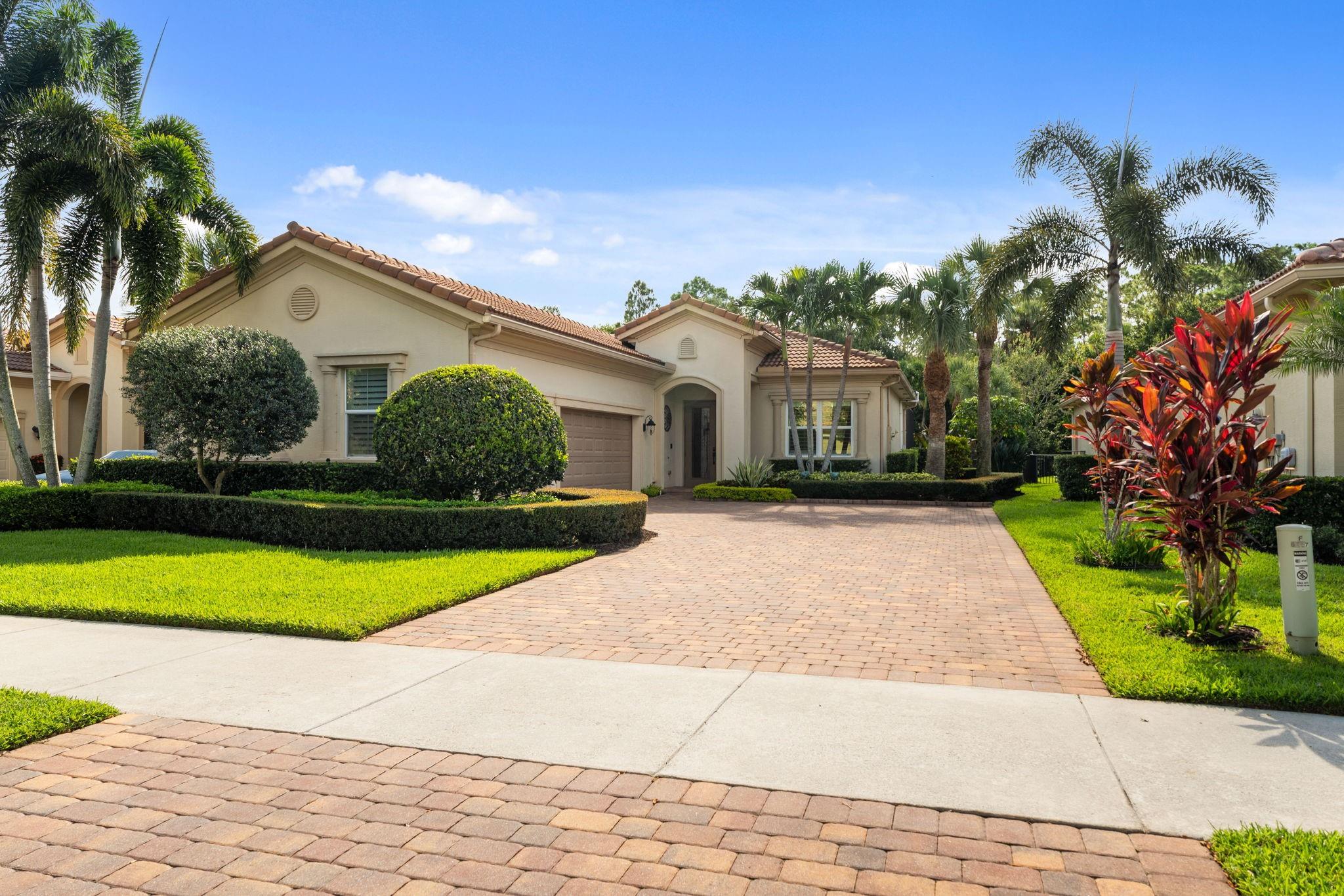 Experience the best of Florida living in this gorgeous former model home with standout upgrades! Professional landscaping contributes to the unparalleled curb appeal. The entire interior has been freshly painted and features a beautifully updated kitchen with brand new appliances along with 10 ft. ceilings throughout, coffered ceilings, custom crown molding, plantation shutters and more! The air conditioned 3 car garage with fast lowering racks for storage is a car enthusiast's dream! Enjoy the convenience of living in a smart home with the ability to control the irrigation, thermostat, cameras, pool equipment and garage door all from your phone. This beautiful home is conveniently located near I95 for ease of travel! All of this in a gated community with a low HOA! Your dream home awaits!