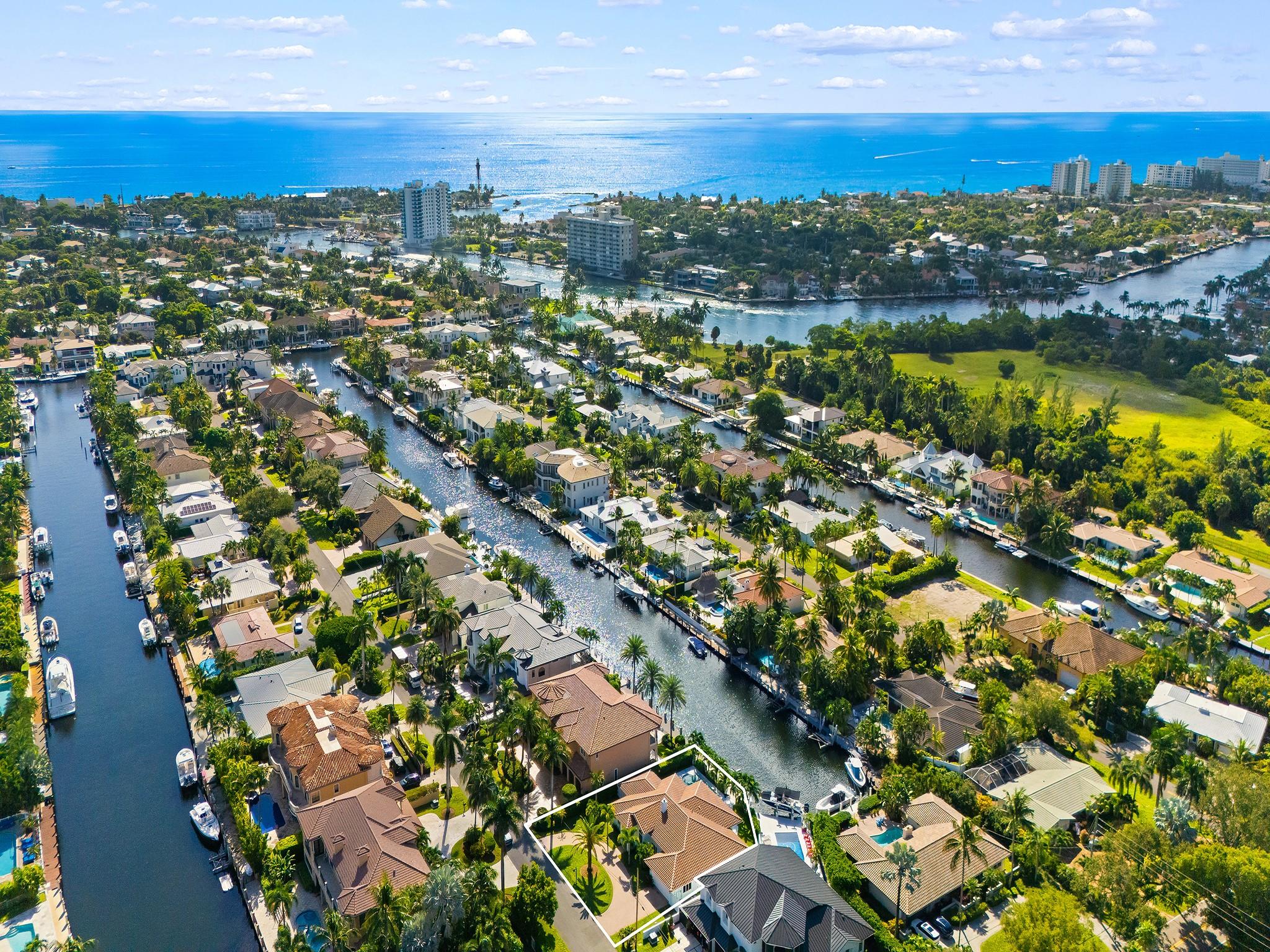Stunning Lighthouse Point Coastal Home offering both community and waterfront lifestyles.  Step inside to discover an open concept layout with volume ceilings.   This home allows for effortless entertaining flowing seamlesly from the gourmet kitchen to the sunlit living areas.  With 4 bedrooms and 3.5 baths and sitting on a spacious 10,000+ sq ft of property,  it's a home that is as spacious as it is inviting!  Imagine waking up every day to serene waterviews and enjoying morning coffee out on the patio.    This home is complete with a brand new 20,000# boat lift and brand new dock - perfect for the sea lover.  Short boat ride to the ocean for fishing and diving.  This charming home is more than a place to live, it's a place to love!  Schedule your private showing and Let's Get You Moving!