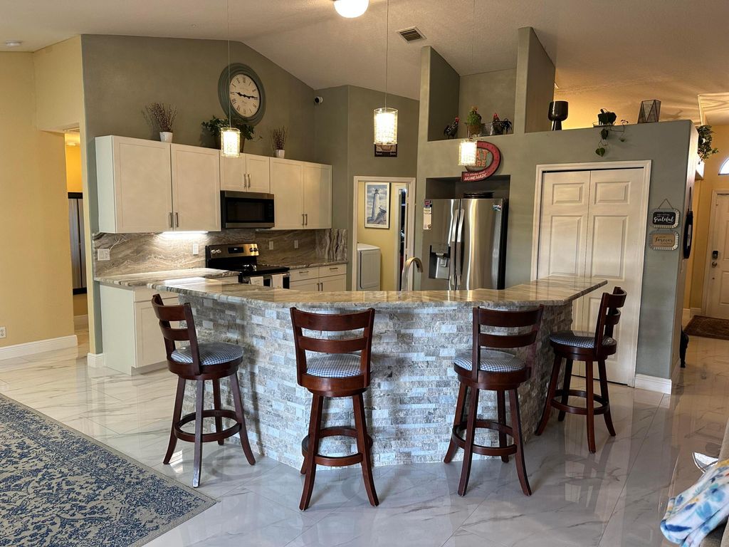 Photo of 4239 SW Callicoe Street, Port Saint Lucie, FL 34983 (MLS # R11163063)