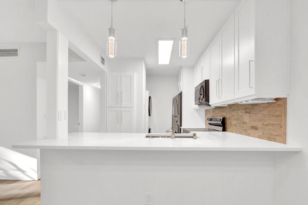 Photo of 3402 Gardens East Drive #19a, Palm Beach Gardens, FL 33410 (MLS # R11159960)