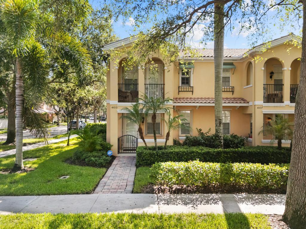 The layout of this immaculate end-unit townhouse offers the feel of a single-family home, beginning with a spacious living room that flows into the kitchen and great room. The kitchen features granite counters, tile backsplash, GE Cafe SS appliances and newer washer and dryer. A bay window fills the great room with natural light, opening onto a large screened patio--ideal for outdoor entertaining. Upstairs, the primary suite includes 2 closets, a spacious bathroom with double sinks, walk-in shower, soaking tub and a private balcony. Adding to the home's distinctive charm, all light fixtures are antiques sourced from the renowned Maurice's Furnishings, while most of the wood furniture pieces were custom-crafted by the same atelier--bringing timeless character and artisanal warmth throughout