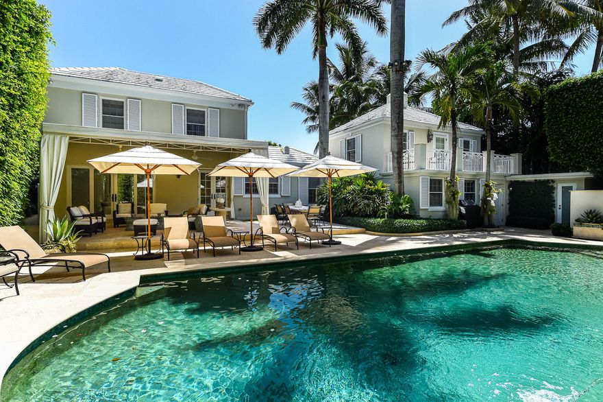 Gorgeously remodeled 6 bedroom/den, 7.1 bathroom Monterey Colonial home designed by renowned Palm Beach architect John Volk. Situated on a 14,500 +/- square foot lot, this home features over 7,000 total square feet, Venetian plastered formal living room with fireplace, beautiful interior loggia leading to gourmet eat-in chef's kitchen overlooking pool and entertainment spaces. Iconic John Volk staircase leads to second floor sitting room and expansive owner's suite with gorgeous owner's bath with stunning marble floors and details. Beautiful, serene landscaping surrounds large pool and covered patio. Gracious entry approach and parking with circular drive and driveway leading to 2 car air-conditioned garage with second floor guest apartment. Fantastic In-Town location in close proximity to the Lake Trail, Royal Poinciana Plaza, and the Breakers.