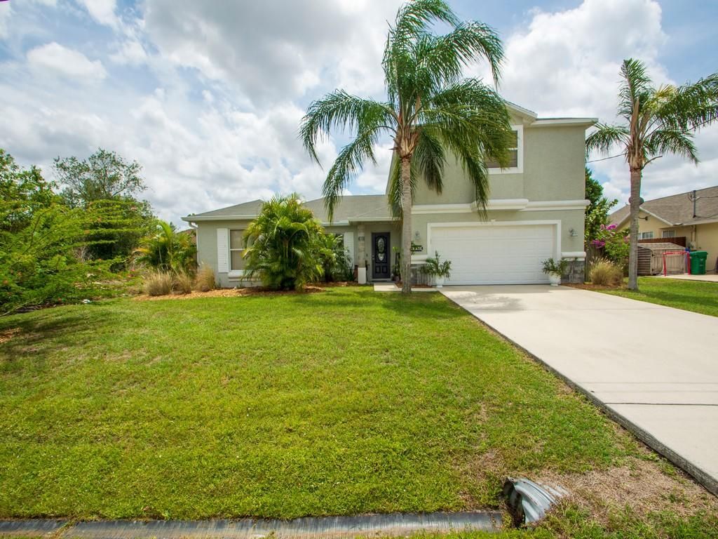 Photo of 5950 NW Wolverine Road, Port Saint Lucie, FL 34986 (MLS # R10710270)
