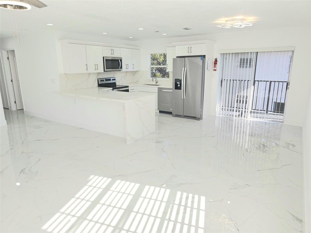 Photo of 1848 NW 55th Avenue #4x, Lauderhill, FL 33313 (MLS # B26003825)