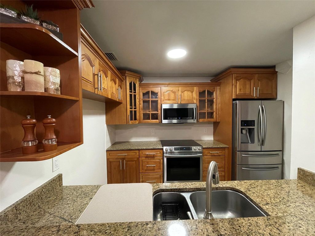 Photo of 3791 Cocoplum Circle #35127, Pompano Beach, FL 33063 (MLS # F10435148)