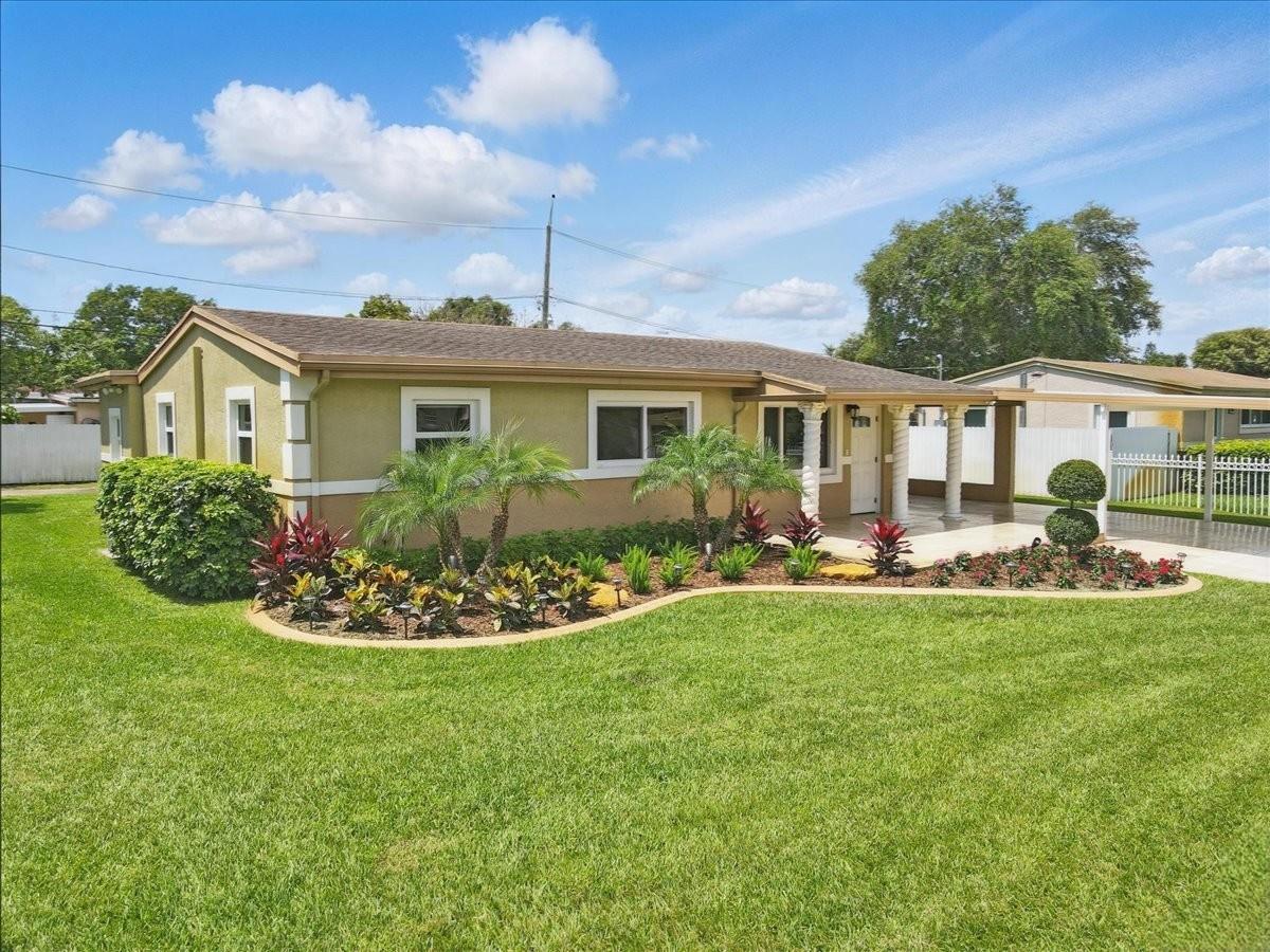 This beautifully maintained 3-bedroom, 2-bath home reflects the incredible care and love of its owner. Every inch of the property is immaculate, creating the feel of a brand-new home. With impact windows and doors, the home offers both beauty and security. The tastefully updated kitchen and bathrooms feature granite and quartz countertops and stainless-steel appliances, creating a modern, inviting atmosphere.
The exterior of the home is just as impressive, with a manicured lawn and lush landscaping that is the envy of the neighborhood. The fully fenced yard with electronic gate provides privacy, while the extended carport offers room for multiple cars. Conveniently located just minutes from a variety of shops, restaurants, major highways and the Hard Rock Stadium.