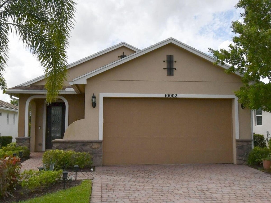Photo of 10002 SW Trumpet Tree Circle, Port Saint Lucie, FL 34987 (MLS # B26065877)