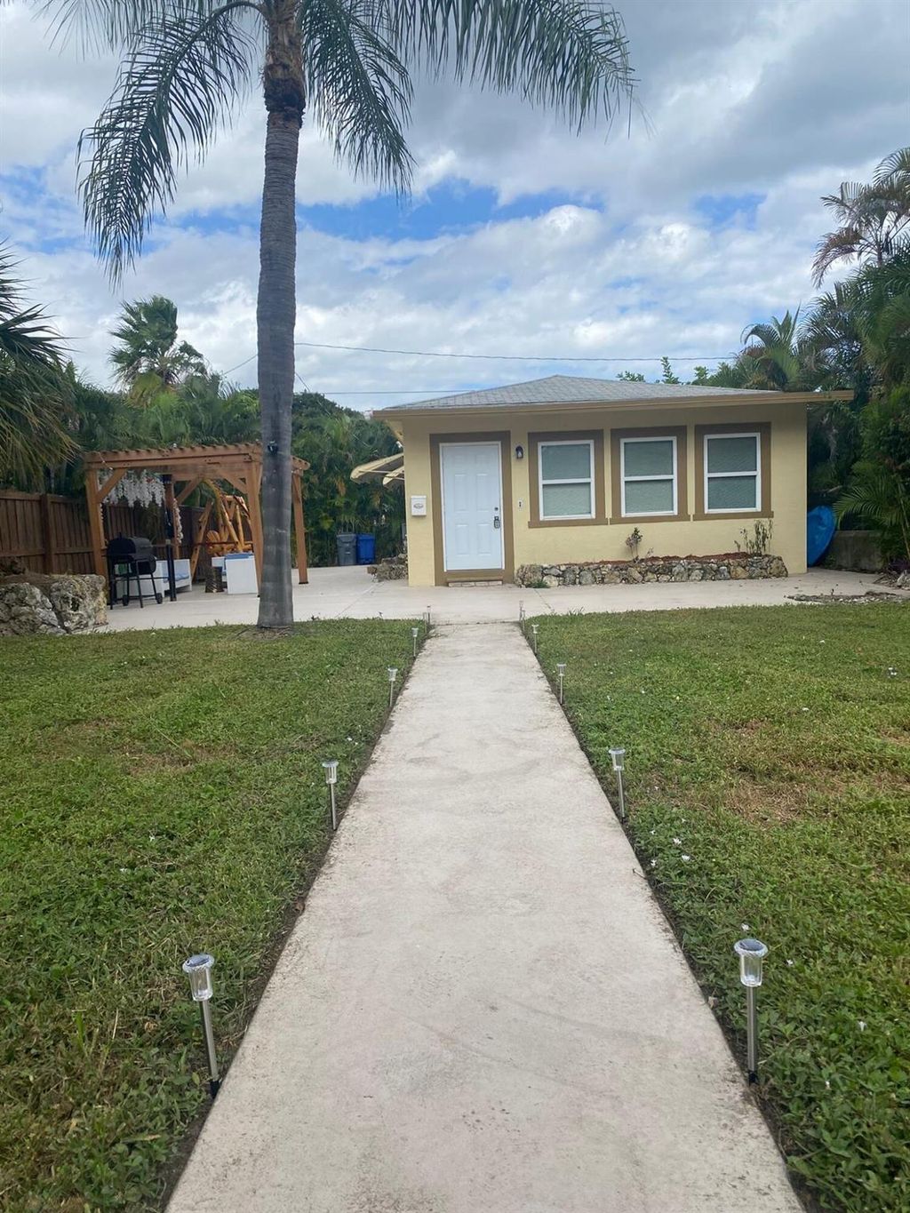 Photo of 135 Hawthorne Drive, Lake Park, FL 33403 (MLS # R11114878)