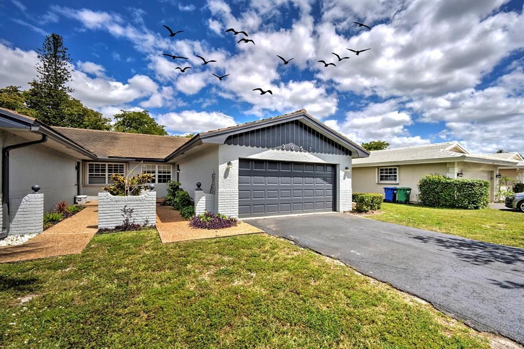 Photo of 3057 NW 103rd Lane, Coral Springs, FL 33065 (MLS # B26011188)