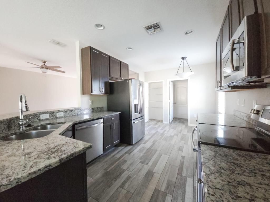 Photo of 185 SW Exmore Avenue, Port Saint Lucie, FL 34983 (MLS # R11147670)